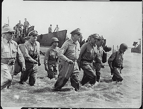 General Douglas MacArthur wades ashore during initial landings at Leyte, Philippine Islands. Army Signal Corp Photo, NARA ID 531424